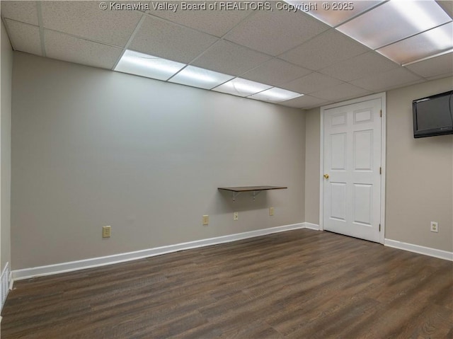 227 Maplewood Ests, Scott Depot, WV 25560 - basement with a paneled ceiling and dark wood-style floors
