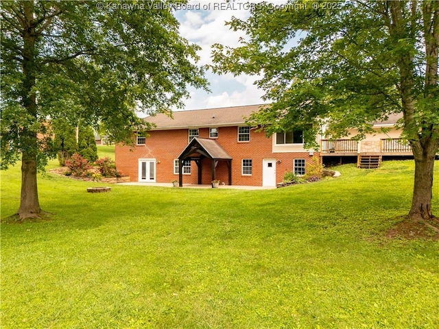 227 Maplewood Ests, Scott Depot, WV 25560 - back of property featuring a wooden deck, a lawn, brick siding, and french doors