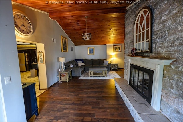 969 Airport Rd, Chapmanville, WV 25508 - living area featuring wood ceiling, wood finished floors, vaulted ceiling, and a tile fireplace
