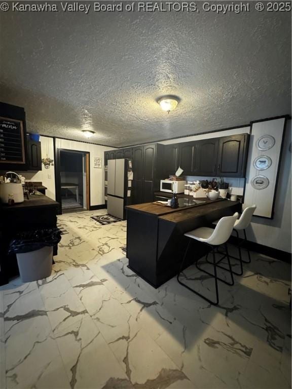 969 Airport Rd, Chapmanville, WV 25508 - home office featuring light marble finish flooring and a textured ceiling