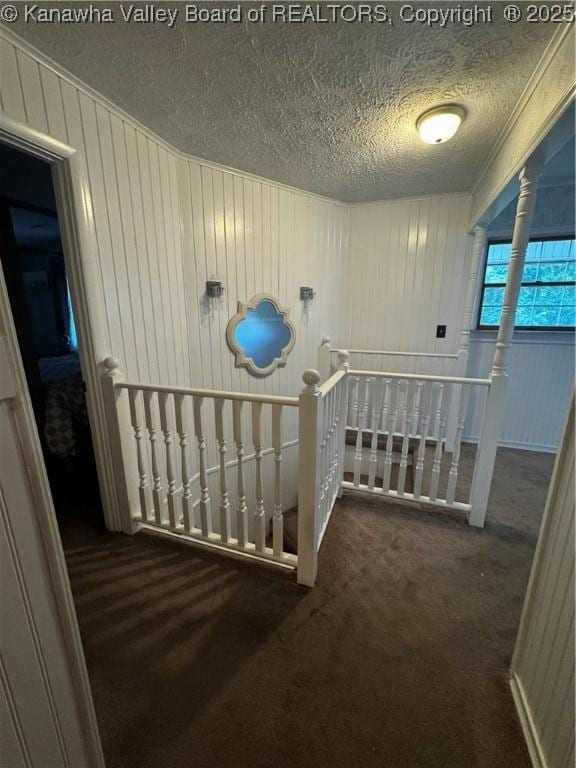 969 Airport Rd, Chapmanville, WV 25508 - hall featuring an upstairs landing, carpet, and a textured ceiling