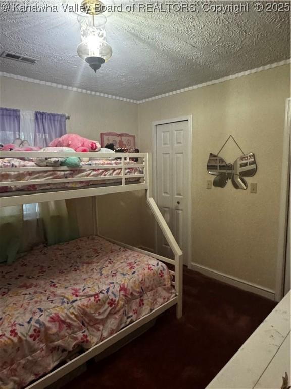 969 Airport Rd, Chapmanville, WV 25508 - bedroom featuring a textured ceiling and carpet