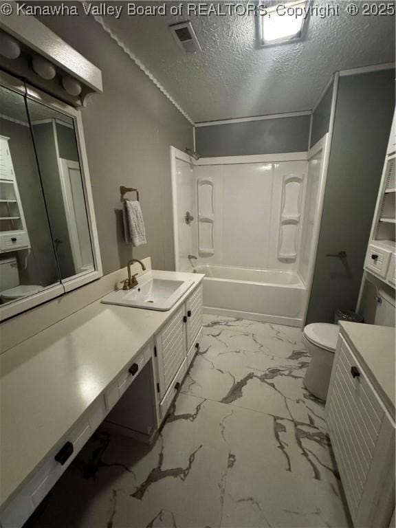 969 Airport Rd, Chapmanville, WV 25508 - bathroom featuring vanity, shower / tub combination, marble finish floors, and a textured ceiling