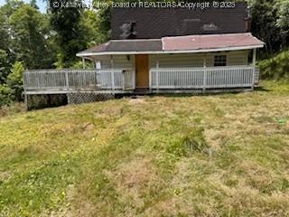 168 Harmon Rd, Charleston, WV 25314 - rear view of property featuring a yard, a wooden deck, and covered porch
