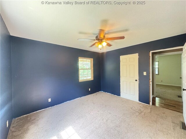 4136 Iva Durst Rd, Leon, WV 25123 - unfurnished bedroom with carpet flooring and ceiling fan