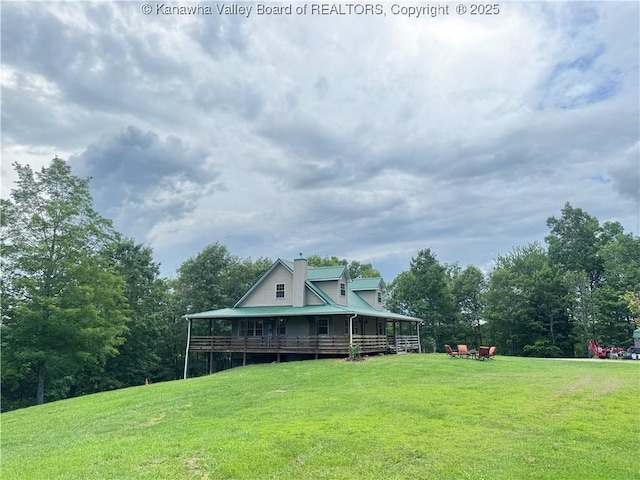 4136 Iva Durst Rd, Leon, WV 25123 - back of property with a lawn and a chimney
