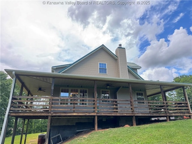 4136 Iva Durst Rd, Leon, WV 25123 - back of property featuring a lawn, a chimney, and a wooden deck