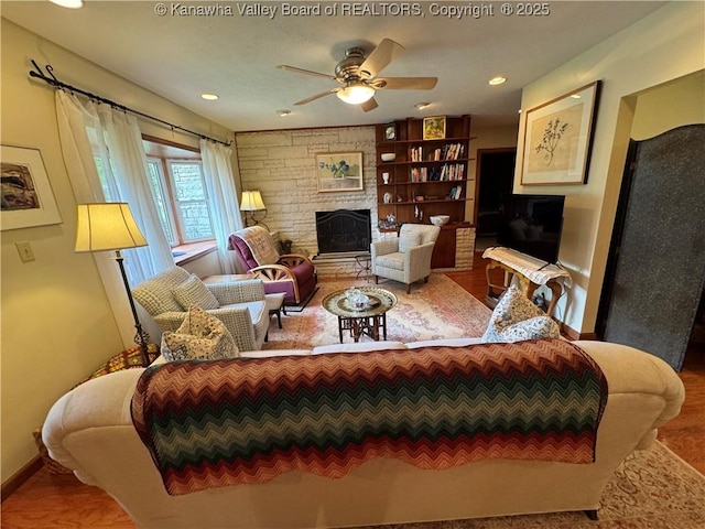 201 Sheridan Cir, Charleston, WV 24315 - living area with a ceiling fan, a large fireplace, and wood finished floors