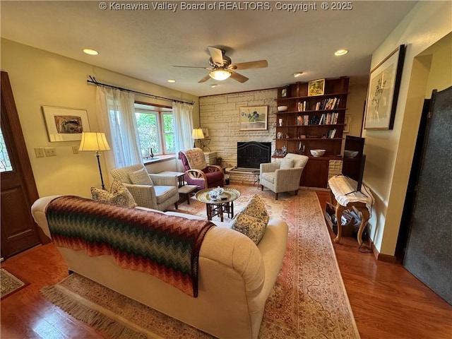 201 Sheridan Cir, Charleston, WV 24315 - living room featuring wood finished floors, a ceiling fan, a fireplace, and recessed lighting