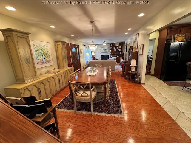 201 Sheridan Cir, Charleston, WV 24315 - dining room featuring light wood-type flooring, recessed lighting, a fireplace, and ceiling fan