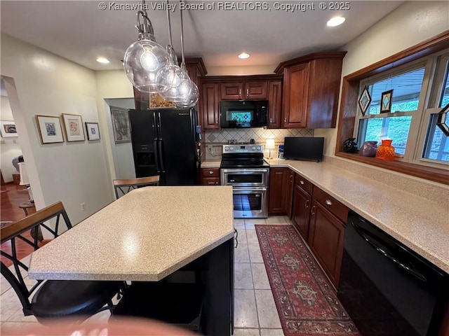 201 Sheridan Cir, Charleston, WV 24315 - kitchen featuring black appliances, light countertops, tasteful backsplash, light tile patterned floors, and recessed lighting