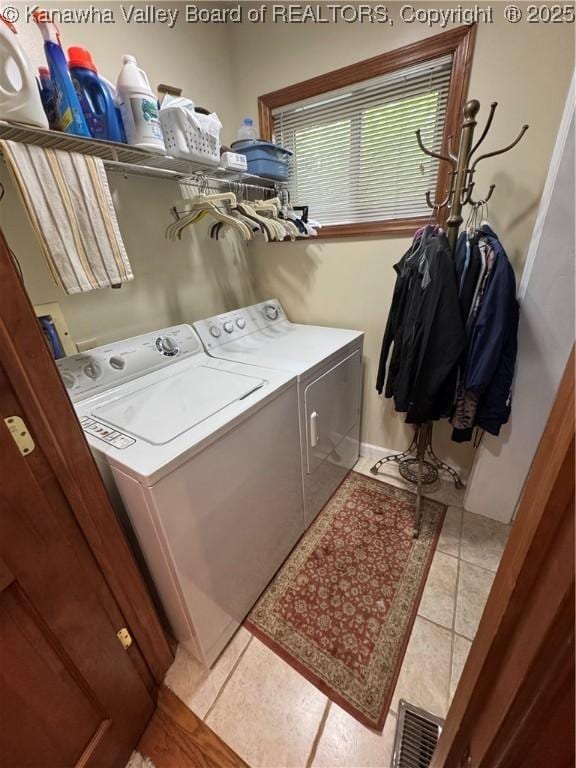 201 Sheridan Cir, Charleston, WV 24315 - laundry area featuring washing machine and clothes dryer and tile patterned floors