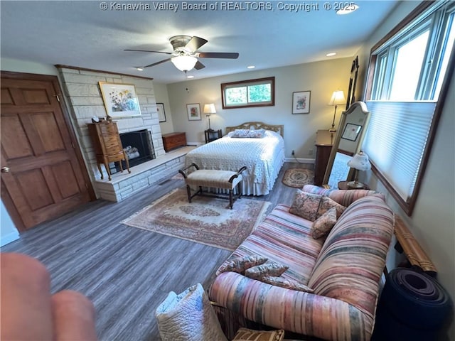 201 Sheridan Cir, Charleston, WV 24315 - bedroom with wood finished floors, a stone fireplace, recessed lighting, and ceiling fan