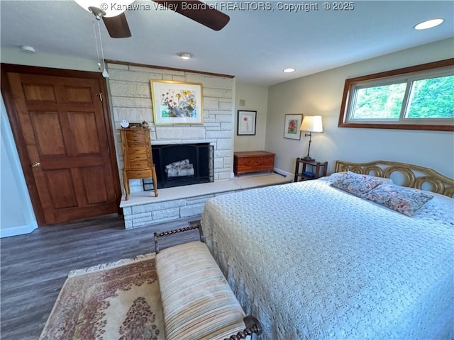 201 Sheridan Cir, Charleston, WV 24315 - bedroom with wood finished floors, a stone fireplace, and recessed lighting