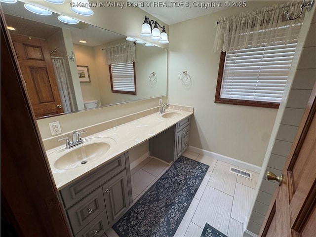 201 Sheridan Cir, Charleston, WV 24315 - bathroom featuring double vanity, tile patterned flooring, and a shower