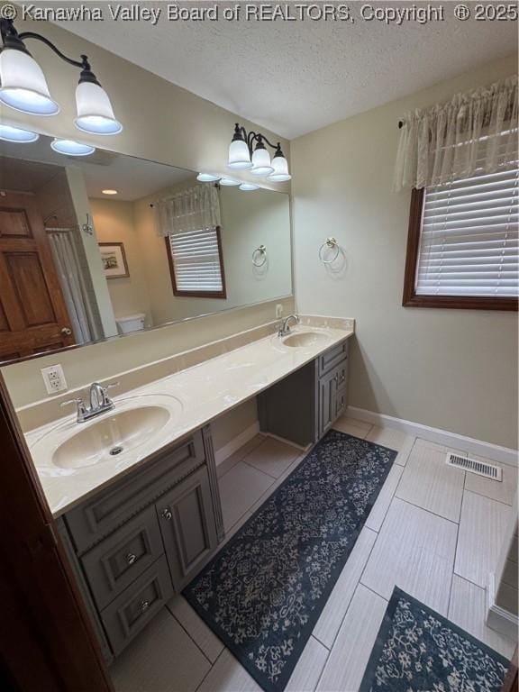 201 Sheridan Cir, Charleston, WV 24315 - full bath featuring double vanity, tile patterned flooring, and a textured ceiling