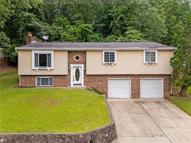 910 Echo Rd, South Charleston, WV 25303 - raised ranch with a garage, driveway, a front lawn, and brick siding