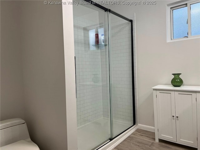 1324 13th St, Nitro, WV 25143 - full bathroom with a stall shower and wood finished floors