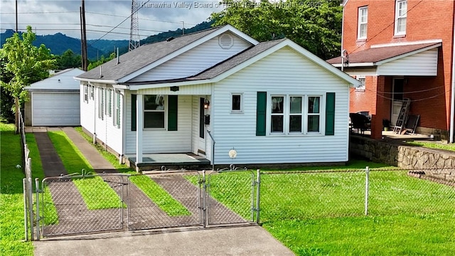108 W Main St, Belle, WV 25015 - bungalow featuring covered porch, a detached garage, a gate, and a fenced front yard