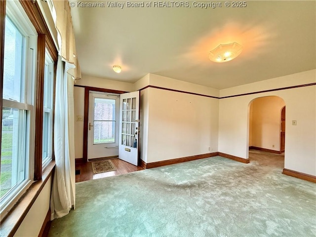 108 W Main St, Belle, WV 25015 - carpeted empty room featuring arched walkways and baseboards