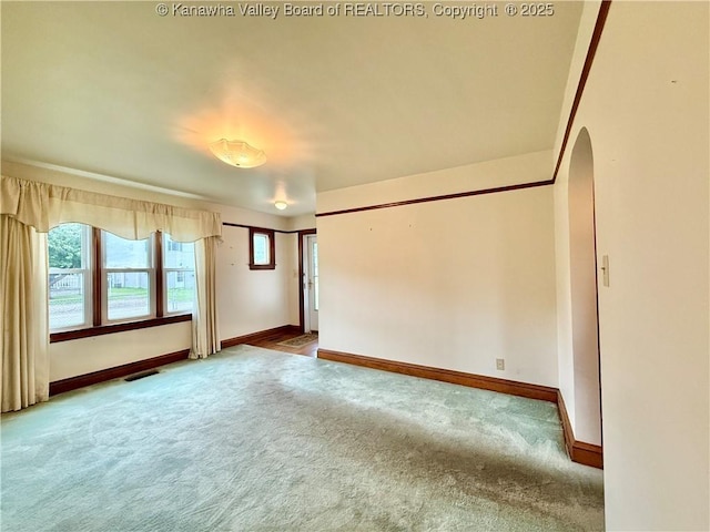 108 W Main St, Belle, WV 25015 - carpeted empty room featuring baseboards and arched walkways
