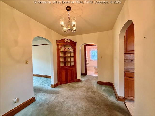 108 W Main St, Belle, WV 25015 - hall featuring arched walkways, carpet floors, and a chandelier