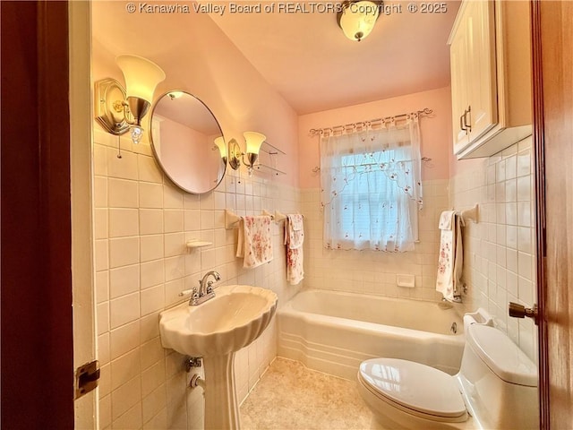 108 W Main St, Belle, WV 25015 - full bathroom with tile walls, a tub to relax in, tile patterned floors, and a wainscoted wall