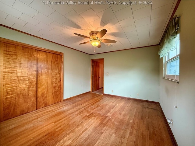 108 W Main St, Belle, WV 25015 - unfurnished bedroom featuring ornamental molding, light wood finished floors, and a ceiling fan
