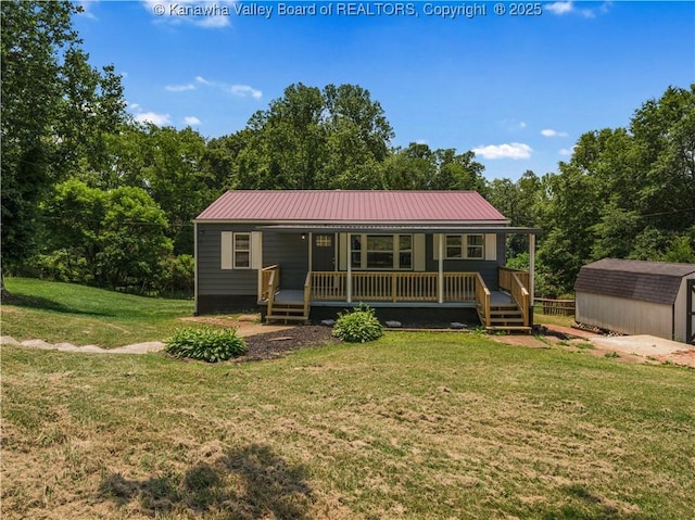 5285 Kelly Rd, Charleston, WV 25313 - rear view of house with a storage unit, a yard, and a metal roof