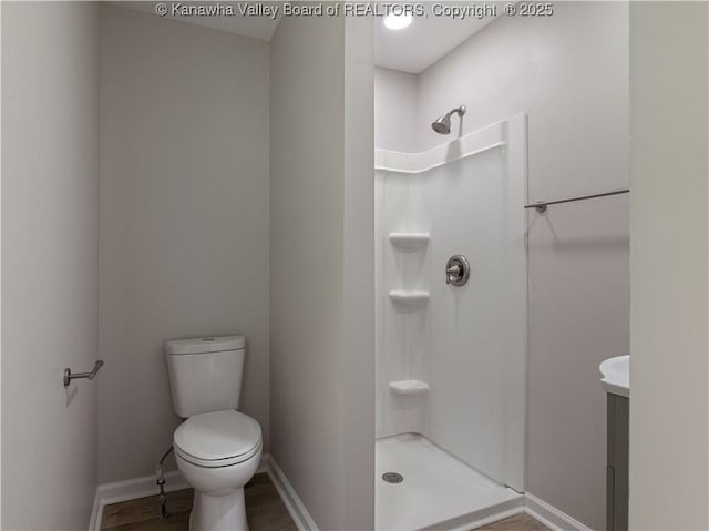 5285 Kelly Rd, Charleston, WV 25313 - bathroom with a stall shower, wood finished floors, and vanity