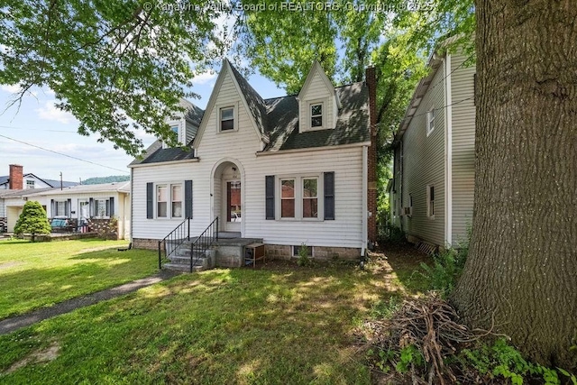 104 E Riverview Dr, Belle, WV 25015 - view of front facade featuring a front yard, roof with shingles, and a chimney