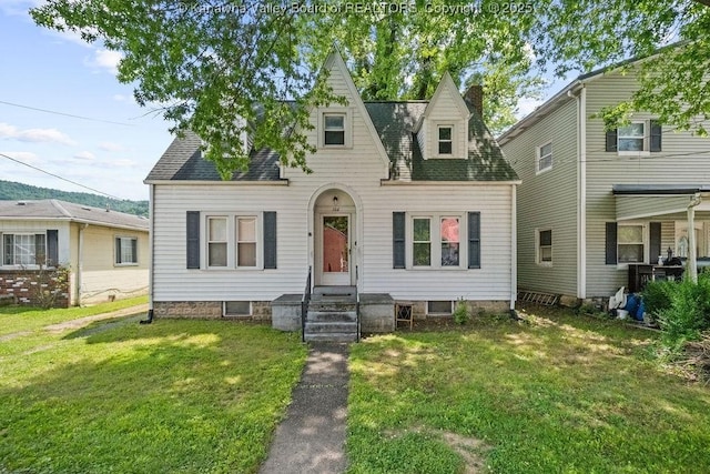 104 E Riverview Dr, Belle, WV 25015 - view of front of home with a front lawn, a shingled roof, and a chimney