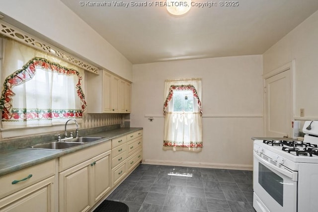 104 E Riverview Dr, Belle, WV 25015 - kitchen featuring white gas stove and cream cabinets