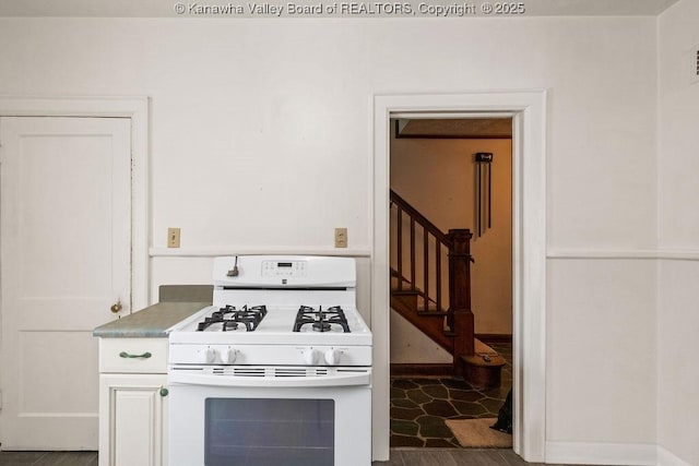 104 E Riverview Dr, Belle, WV 25015 - kitchen with white range with gas cooktop and baseboards