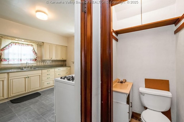 104 E Riverview Dr, Belle, WV 25015 - kitchen with cream cabinetry and white range with gas cooktop