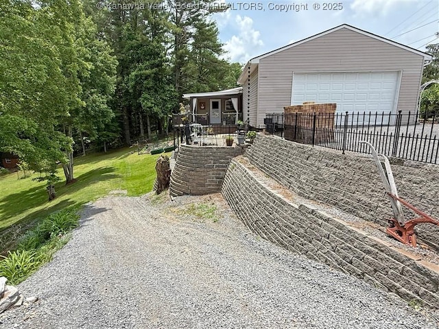 960 Grandview Rd, Daniels, WV 25832 - view of side of home featuring gravel driveway and covered porch