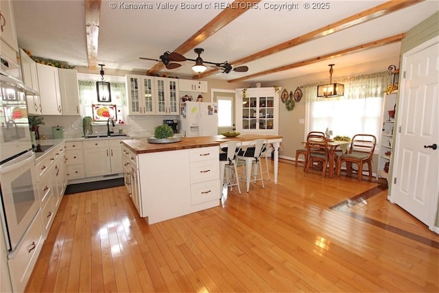 960 Grandview Rd, Daniels, WV 25832 - kitchen with wood counters, white appliances, light wood-style floors, white cabinetry, and beam ceiling