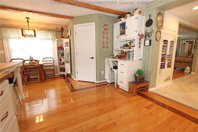 960 Grandview Rd, Daniels, WV 25832 - kitchen featuring light wood-type flooring, white cabinets, beamed ceiling, pendant lighting, and light countertops