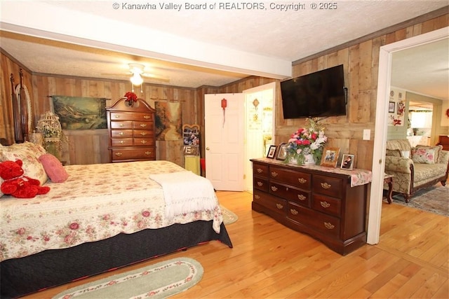 960 Grandview Rd, Daniels, WV 25832 - bedroom featuring wooden walls, light wood-style flooring, beamed ceiling, and crown molding