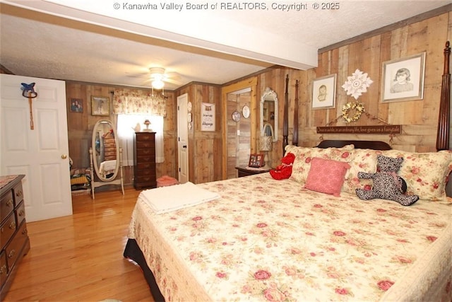 960 Grandview Rd, Daniels, WV 25832 - bedroom featuring wooden walls, light wood finished floors, a textured ceiling, beam ceiling, and a ceiling fan