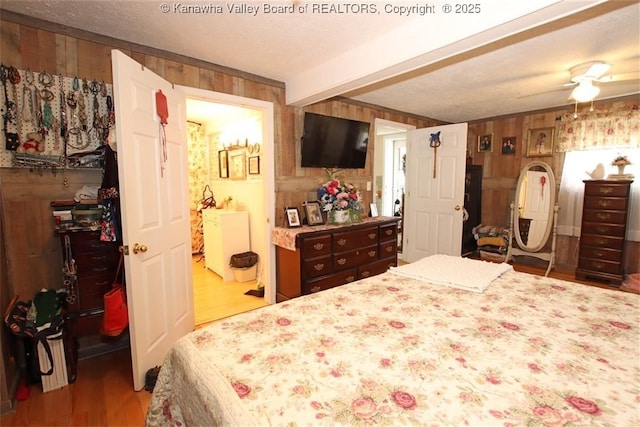 960 Grandview Rd, Daniels, WV 25832 - bedroom featuring wood finished floors, wood walls, beam ceiling, a walk in closet, and a closet