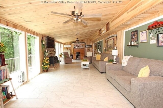 960 Grandview Rd, Daniels, WV 25832 - living area featuring wooden ceiling, vaulted ceiling, a ceiling fan, wooden walls, and a fireplace