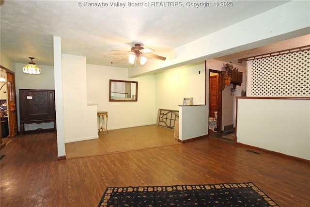 322 16th St, Dunbar, WV 25064 - unfurnished living room with wood finished floors and a ceiling fan
