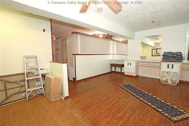322 16th St, Dunbar, WV 25064 - kitchen with radiator, wood finished floors, a ceiling fan, and a textured ceiling
