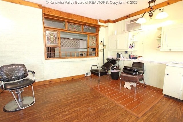 322 16th St, Dunbar, WV 25064 - living area with dark wood finished floors and a wall mounted AC