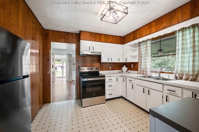 9627 Procious Maysel Rd, Procious, WV 25164 - kitchen featuring stainless steel appliances, under cabinet range hood, light flooring, wood walls, and open shelves