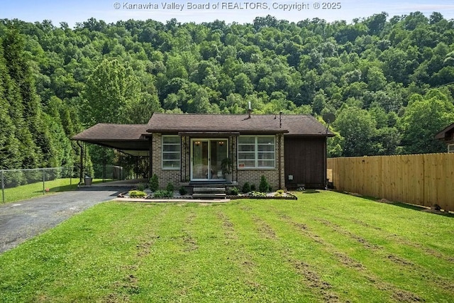 9627 Procious Maysel Rd, Procious, WV 25164 - view of front of property with asphalt driveway, a view of trees, brick siding, and an attached carport