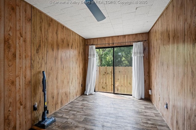 9627 Procious Maysel Rd, Procious, WV 25164 - empty room featuring wooden walls and wood finished floors