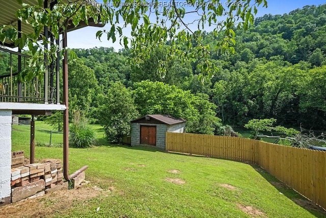 9627 Procious Maysel Rd, Procious, WV 25164 - fenced backyard featuring a shed and a forest view