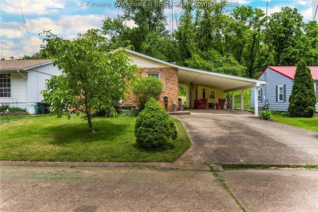3983 39th St E, Nitro, WV 25143 - view of front of property with a front yard, concrete driveway, an attached carport, and brick siding